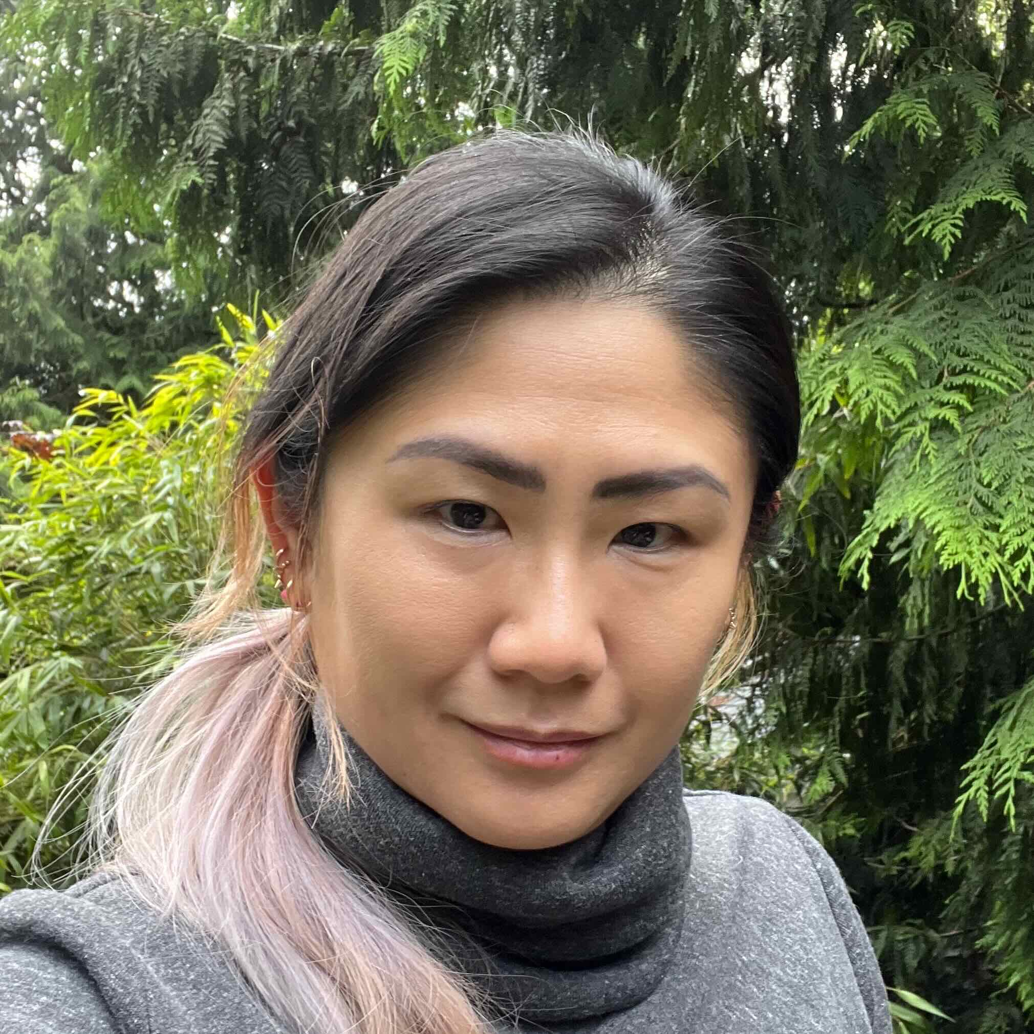 Photo of an Asian woman with pink hair